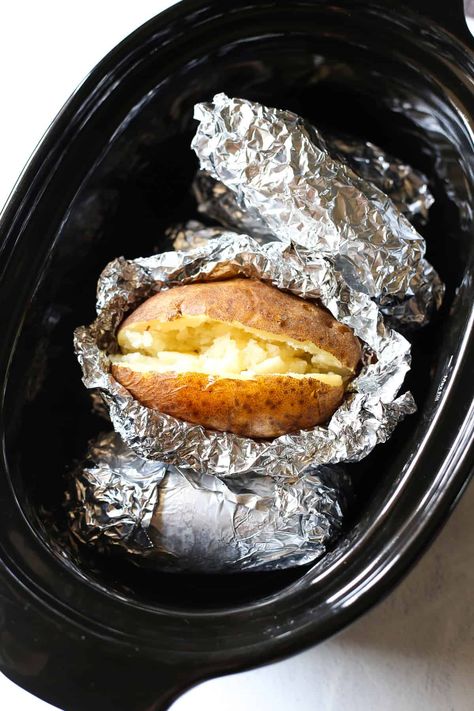 Prepare to fall in love with the easiest way to enjoy perfectly fluffy and delicious baked potatoes. Crock Pot Baked Potatoes require minimal effort. Set it and forget it for a comforting side dish or hassle-free meal. Baked Potato In Crock Pot, Baked Potatoes In Roaster, Baked Potatoes In The Crockpot, Baked Potatoes In Crock Pot, Filet Mignon Oven, Crockpot Baked Potatoes, Potatoes Crock Pot, Russet Potato Recipes, Crock Pot Baked Potatoes