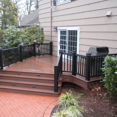 Deck Design Ideas, Pictures and Remodels - angle stairs off to the side to bypass garage walk thru? - build patio out to side? or on the opposite side? A/C unit on that side tho - how about a T shape? Deck To Patio Transition, Patio Transition Ideas, Deck To Patio, Screen Deck, Build Patio, Hot Tub Pergola, Privacy Screen Deck, Deck Building Plans, Deck Design Ideas