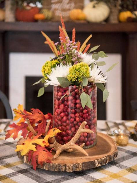 Easy Centerpieces for Thanksgiving or Fall Parties | HGTV Easy Centerpieces, Thanksgiving Table Settings Diy, Diy Thanksgiving Centerpieces, Thanksgiving Buffet, Simple Centerpieces Diy, Thanksgiving Floral Arrangements, Winter Table Setting, Thanksgiving Centerpieces Diy, Thanksgiving Entertaining