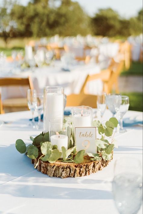 Wood And Eucalyptus Centerpiece, Wood Round Wedding Centerpieces, April Wedding Centerpieces, Wedding Table Decorations Round, Wedding Table Decorations Black, Wood Round Centerpiece, Table Decorations Black, Wood Centerpieces Wedding, Frangipani Wedding