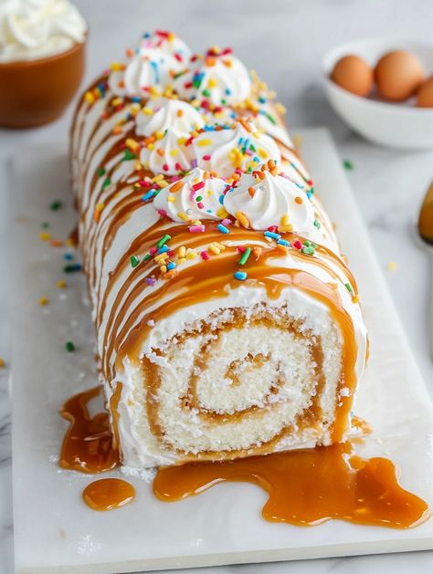 Caramel Swirl Birthday Cake Roll   𝗜𝗻𝗴𝗿𝗲𝗱𝗶𝗲𝗻𝘁𝘀 🍰 - 4 eggs - 3/4 cup granulated sugar - 1 teaspoon vanilla extract - 1 cup all-purpose flour - 1 teaspoon baking powder - 1/4 teaspoon salt - 1/4 cup powdered sugar - 1/2 cup caramel sauce - Whipped cream for filling Caramel Roll Cake, Food Polls, Caramel Rolls, Work Recipes, Caramel Desserts, Cake Rolls, Bake Cake, Caramel Cake, Easy Family Recipes