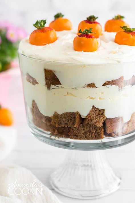 This carrot cake trifle has layers of moist carrot cake and no-bake cheesecake filling then topped with adorable strawberry "carrots". #carrotcake #easter #easterdessert #easterrecipes #dessert #trifle #cake Easter Trifle Desserts, Carrot Cake Trifle, Easter Trifle, Strawberry Carrots, Trifle Bowl Recipes, Cake Trifle, Pineapple Dream Dessert, Trifle Dessert Recipes, No Bake Cheesecake Filling