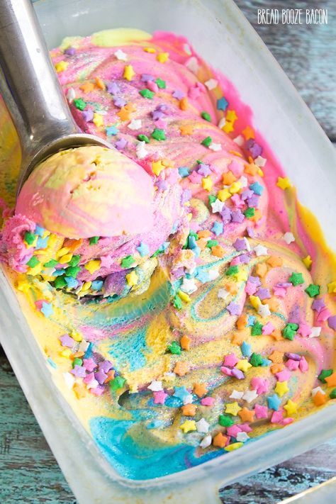 Unicorn Ice Cream is magic on a cone! There's nothing better on a hot day than rainbow ice cream that's covered in star sprinkles and glitter! Bread Booze Bacon, Unicorn Ice Cream, Unicorn Desserts, Pastel Cupcakes, Rainbow Ice Cream, Star Sprinkles, Rainbow Food, Unicorn Foods, Ice Cream Popsicles