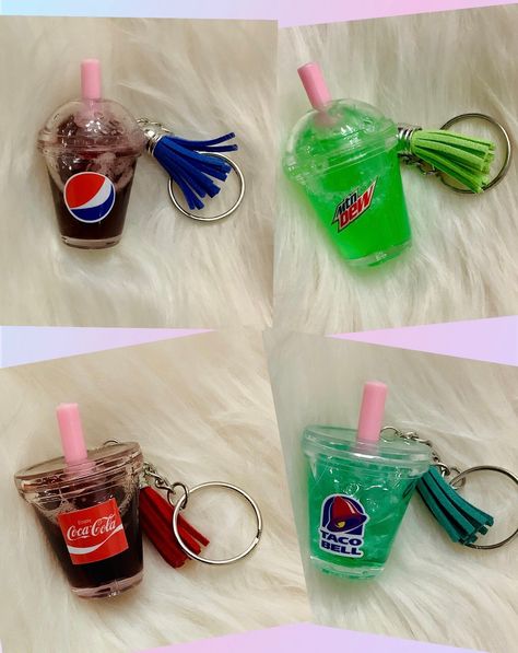 Mini Soda Cup Keychain! There is liquid and fake ice chips inside. The color will settle after a while, so you must shake it for it to look normal again This unique keychain features a miniature representation of a refreshing soda drink. The intricate design and use of liquid material make it a beautiful addition to any keychain collection. Handmade with care, this keychain is perfect for those who appreciate the artistry that goes into creating small accessories. The food & drink theme make it a great gift for soda enthusiasts or anyone who loves quirky and fun accessories. Suitable for teens, men and women, this Soda Keychain is sure to be a conversation starter. Resin Drink Keychain, Drink Keychain, Liquid Keychain, Cup Keychain, Coffee Keychain, Candy Theme Birthday Party, Ice Chips, Keychain Collection, Soda Cup