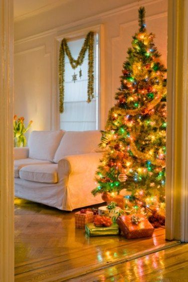 How to Mix Clear and Colored Lights on a Christmas Tree | eHow Colored Christmas Lights Outdoor, White And Colored Christmas Lights, Colored Light Christmas Tree Ideas, Christmas Tree Story, Christmas Tree Colored Lights, Christmas Tree With Coloured Lights, Christmas Lights Tree, Colored Christmas Lights, Christmas Lights Outdoor