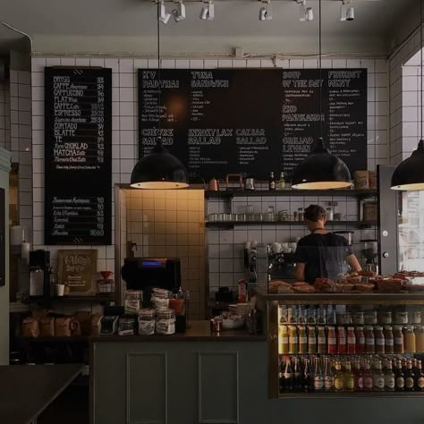 Menu board in a coffee shop. Person standing at the counter. Cloudy weather