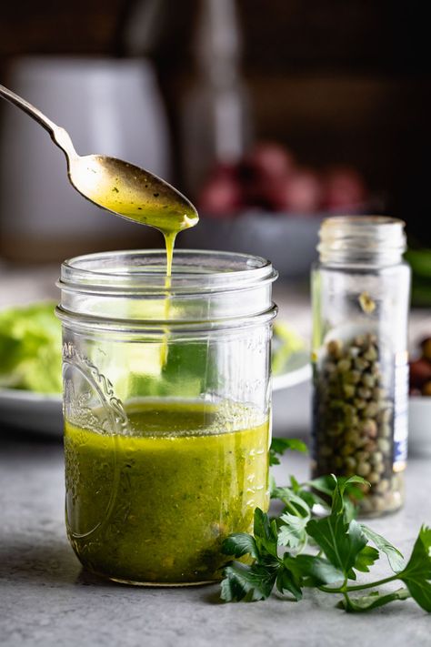 Salad Nicoise Dressing made with capers, garlic, parsley and white wine vinegar. It is bright and tart and is lovely drizzled over salad nicoise. This simple blender vinaigrette also pairs well with seafood of all kinds. #salad #saladdressing #vinaigrette #saladnicoise #paleo #primal #lowcarb Nicoise Salad Dressing Vinaigrette, Salad Nicoise Dressing, Nicoise Salad Recipe Dressing, Caper Salad Dressing, Parsley Dressing Recipe, Parsley Salad Dressing, Salad Nicoise Recipe, Nicoise Salad Dressing, Recipe With Parsley