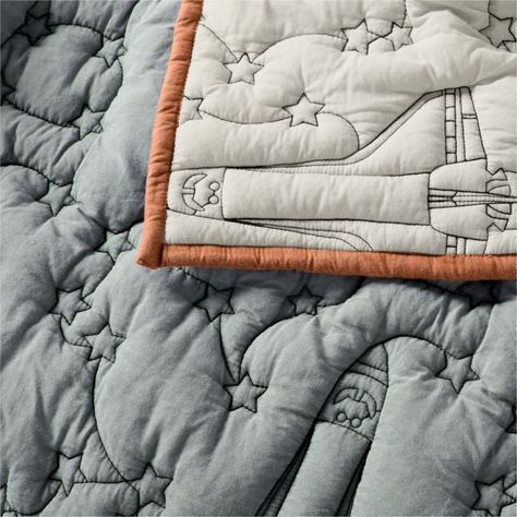 With its repeating stitched pattern of space shuttles and starry skies, our Space Shuttle Embroidered Quilt is sure to inspire dreams of faraway galaxies. The 100% organic cotton shell feels invitingly soft, and the allover embroidery creates subtle textural interest. For easy versatility, the smoke blue front reverses to cool gray with almond brown binding. Cool cosmic fact: From 1981-2011, space shuttles carried astronauts on their missions to space. They were large enough to carry satellites, Kids Outer Space Bedroom, Outer Space Kids Room, Little Boys Bedding, Astronaut Room For Boys, Dusty Blue Boys Room, Space Theme Toddler Room, Boys Bedroom Space Theme, Kids Bedding Ideas, Space Themed Bedroom Boys