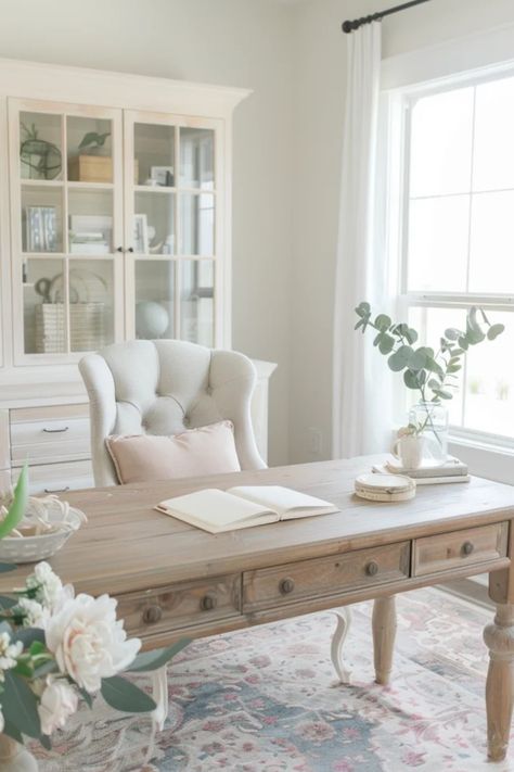 Bright, cozy reading nook with a plush chair beside a window, a wooden coffee table with an open book, surrounded by calming neutral tones and plant accents. Study Ideas Room Home Office, Study Styling, Feminine Home Office Classy, French Country Office, Feminine Office Space, Feminine Home Office, Feminine Home Office Ideas, French Office, Feminine Home