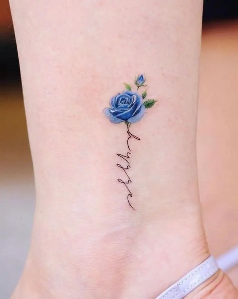 Blue Rose Tattoos: Meanings, Tattoo Designs & Placement Blue Rose Tattoo Meaning, Geranium Tattoo, Rose Tattoo On Ankle, Blue Flower Tattoos, Mum Tattoo, Rose Tattoo Meaning, Ankle Tattoo Designs, Tattoos Cool, Flower Tattoo Meanings