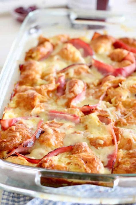 Tender and delicious Croissant Breakfast Casserole!  Store bought baked croissants, deli ham, gruyere cheese (or sub swiss) and an easy to make custard of eggs and half and half! Stuffed Croissant French Toast Casserole, Cheesy Ham And Gouda Croissant Casserole, Ham Egg And Cheese Croissant Breakfast, Ham Swiss Croissant Bake, Bacon And Cheese Croissant, Bacon Egg And Cheese Croissant Casserole, Croissant Breakfast Casserole Overnight, Croissant Breakfast Recipes, Crossiant Casserole Recipes