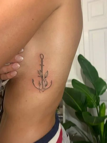 Flower And Anchor Tattoo, Womens Rib Cage Tattoo Ideas, Anchor Rib Tattoo, Anchor Flower Tattoos For Women, Anchor Tattoo With Words, Flower Anchor Tattoo, Small Anchor Tattoos For Women Simple, Anchor Tatoos Woman, Feminine Anchor Tattoo Beautiful