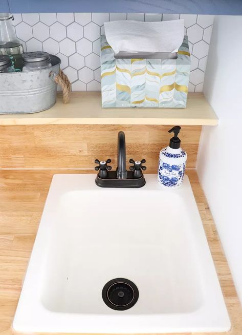 Laundry Room Sink Ideas: 10 Tips for Your Utility Space | Hunker Utility Room Sink Cabinet, Small Sink For Laundry Room, Small Sinks For Laundry Room, Small Laundry Sink Ideas, Laundry Room With Small Sink, Laundry Room Bathroom Combo Utility Sink, Small Sink In Laundry Room, Corner Sink In Laundry Room, Laundry Room Sinks Ideas