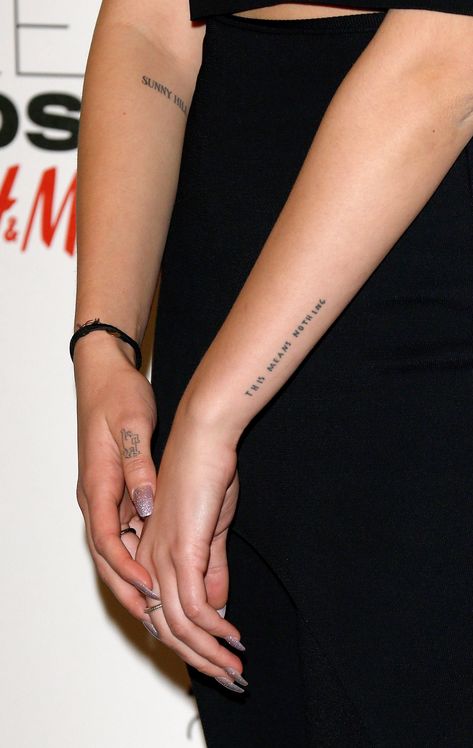 Dua Lipa's "This Means Nothing." Tattoo Tattoos With Beautiful Meaning, Dua Lipa Tattoo, Patience Tattoo, No Tattoo, Words Tattoo, Font Tato, Wörter Tattoos, Cute Tiny Tattoos, Red Tattoos