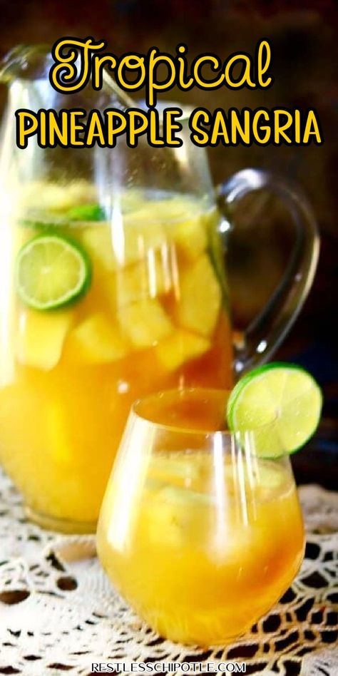 Tropical Pineapple Sangria is a deliciously light and fruity drink that's perfect with everything from grilled meats to game day snacks. Yellow Sangria, Sangria Recipes Pinapple, Tropical Sangria Recipe, Pineapple Sangria Recipes, Pineapple Sangria, Sangria Drink, Yummy Summer Drinks, Alcoholic Punch Recipes, Summer Drinks Alcohol