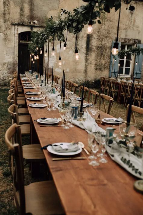 Sassi Holford Wedding Dress or an Outdoor Rustic Wedding in France with Blue Colour Scheme and Edison Bulb Decor by Marine Marques Photography French Wedding Flowers, Edison Bulb Wedding, Rustic Blue Wedding, Boot Wedding, Hanging Foliage, Hanging Wedding Dress, Installation Wedding, Outdoor Rustic Wedding, Blue Colour Scheme