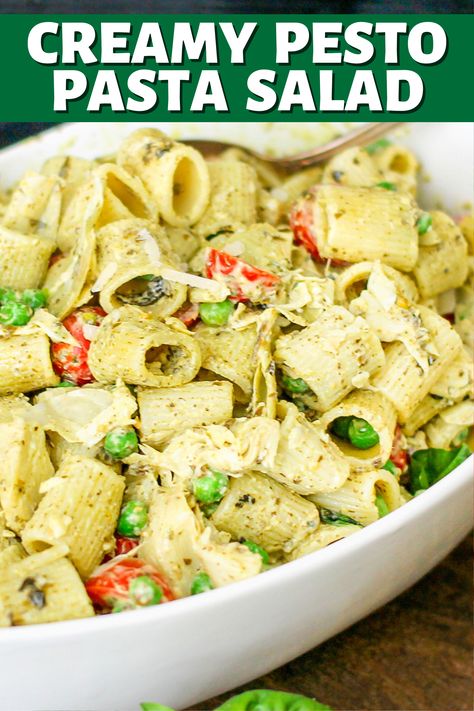 Full of tomatoes, artichokes, peas, and topped with a creamy pesto sauce; this Creamy Pesto Pasta salad is sure to be a favorite! Cold Creamy Pesto Pasta Salad, Jimmy John’s Pesto Pasta Salad Recipe, Jimmy Johns Pesto Pasta Salad, Pesto Pea Pasta Salad, Creamy Pesto Pasta Salad, Pioneer Woman Pasta Salad, Pesto Tortellini Salad, Pesto Ravioli, Easy Pesto Pasta