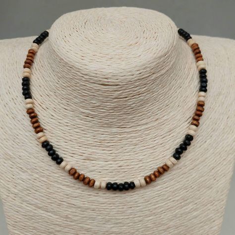 "This Wood Bead Surf Necklace has been lovingly made using brown, Black and cream 4mm wooden beads. Ideal for Men or Women, These are lightweight and tactile beads. Threaded on strong 7 strand Tiger Tail wire and finished with wire guardians, a trigger clasp and optional extender chain. Other similar styles available at: https://www.etsy.com/uk/shop/CraftHutCornwall?section_id=35841521 Typical packaging as shown in images. I have carefully selected packaging to protect your jewellery in transit, Male Beaded Jewelry, Mens Necklace Diy, Men Bead Necklace, Diy Men Necklace, Man Bracelet Beads, Necklace Wooden Beads, Beaded Jewelry Men, Man Beads Necklace, Mens Necklace Beads Handmade