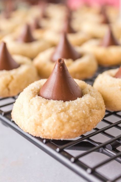 How to make Hershey Kiss Cookies Without Peanut Butter. These delicious chewy and soft cookies use a shortbread cookie as the base and a Hershey kiss is added to the top. They make a great and easy Christmas cookie exchange recipe! Sugar Cookie Hershey Kiss Cookies, Cookies With Hershey Kiss On Top, Hershey Kiss Cookies Recipe, Hershey Kisses Recipes, Kiss Cookie Recipe, Chocolate Kiss Cookies, Brownie Vegan, Hershey Kiss Cookies, Christmas Cookie Exchange Recipes