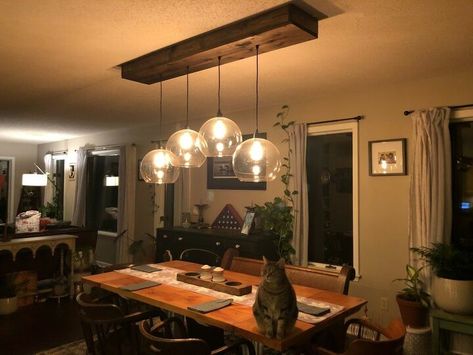 A friend saw my rustic kitchen light fixture and asked if I could adapt it to use these large Ikea globes she just had to have. I said YES! Here's the process. How To Make A Light Fixture, Rustic Kitchen Lights, Kitchen Table Light Fixtures, Light Fixture Diy, Home Remodel Diy, Lamp For Dining Table, Dining Table Lights, Porch Lanterns, Diy Industrial Lighting