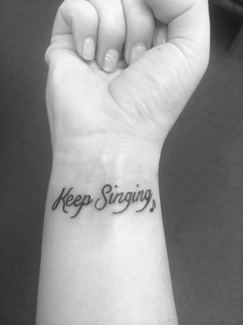 My Keep Singing wrist tattoo with a little music note next to it. Cute and girly and so meaningful! Music Words Tattoo, Sing Tattoo Music, Music Lyric Tattoos For Women, Meaningful Music Tattoos, Singing Tattoo Ideas, Singing Tattoo, Girly Music, Music Graduation, Music Lyric Tattoos