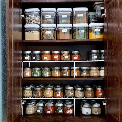 Just imagine the joy of cooking with such a variety of Indian spices and efficient pantry organization! Indian Kitchen Pantry Organization, Indian Spices Organization, Indian Pantry Organization, Indian Spice Organization, Seasoning Organization Cabinet, Indian Kitchen Storage Ideas, Indian Pantry Organization Ideas, Small Indian Kitchen Organisation, Indian Kitchen Decor