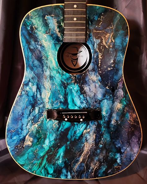 One of a kind beautiful, functional, hand painted, epoxy resin custom guitar. Made with quality epoxy resin and color pigments. UV, water, heat, and scratch resistant. #epoxy #resinart #alcoholink #custom #guitar #art #music #smallbusiness #marble Brand new, triple varnished, epoxy coated and painted. Custom Acoustic Guitars, Resin Paint, Epoxy Art, Epoxy Resin Crafts, Epoxy Resin Art, Epoxy Coating, Guitar Art, Custom Guitar, Healing Crystals