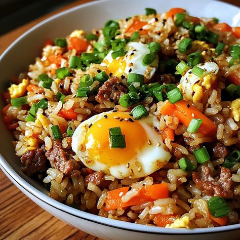 🍚🌟 Try Bokkeumbap—Korean fried rice that’s quick, flavorful, and perfect for using up leftovers. A must-try dish! 🍳🍽️ #Bokkeumbap #FriedRice Bokkeumbap (Korean Fried Rice) Ingredients: Cooked rice (2 cups) Carrots (1/2 cup, diced) Green onions (2, chopped) Eggs (2, beaten) Soy sauce (2 tbsp) Sesame oil (1 tbsp) Garlic (2 cloves, minced) Vegetable oil (2 tbsp) Optional: meat or seafood (1/2 cup, diced) Instructions: Heat oil in a pan, sauté garlic and carrots until tender. Add optional mea... Korean Fried Rice, Cultural Meals, Fried Rice Ingredients, Instagram Recipes, Korean Recipes, Cooked Rice, Rice Ingredients, Trending Recipes, Sesame Oil