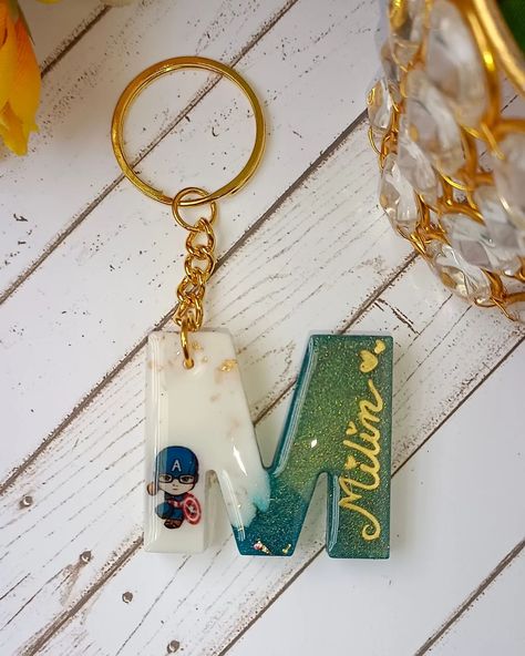 Customised alphabet name keychain with cartoon. In affordable price. DM to order Keychain Resin, Alphabet Names, Name Keychain, Resin Crafts, Alphabet, Quick Saves