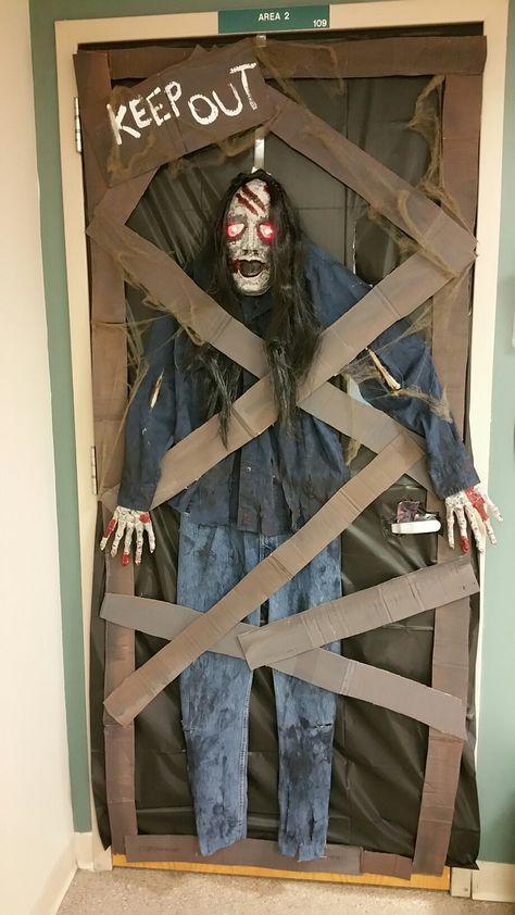 Scary Halloween door decoration Heloween Decoration Office, Halloween Decorating Contest Office, Scary Doors For Halloween, Halloween Door Decorations Classroom Scary, Diy Office Halloween Decorations, Haunted Door Decorations, Spooky Door Ideas, Scary Office Decorations, Tremors Halloween Decoration