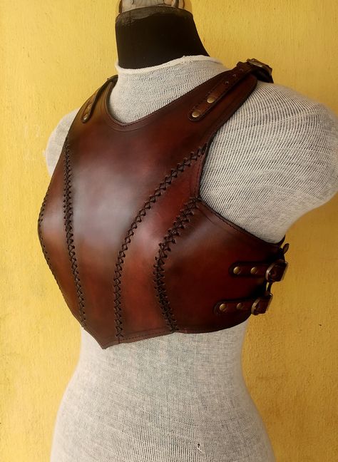 It is handmade leather Renaissance breast plate with hand-sewn leather detailing. It's fully adjustable Top and side with buckles. We used about 2.2 mm thick handmade veg-tan leather. It is hand dyed handmade leather. It is lined with soft leather. Total thickness is 3mm. It is crazy for medieval events and Larp.   It is hand made from sturdy top-grain leather.  Size is available  SM- 30-36" (76- 92cm) ML- 36-42" (92- 107cm) XL: 40-46" (102-117 cm) DETAILS: ► 100% Handmade ► 100% Genuine leather Leather Chest Armor Female, Leather Breastplate Female, Leather Chest Plate, Larp Outfit Female, Leather Fantasy Outfit, Leather Chestplate, Ren Faire Armor, Viking Cosplay Female, Leather Armor Dnd