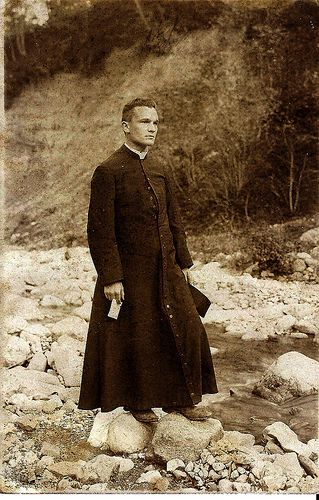 The cassock, an item of clerical clothing, is an ankle-length robe worn by clerics of the Roman Catholic Church. It was the common daily wear around the 1900s Priest Outfit, Holy Orders, The Possession, Catholic Priest, Call Of Cthulhu, Figurative Language, Roman Catholic Church, Straight Forward, Godly Man