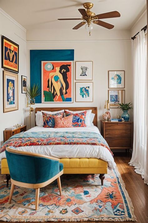 The image showcases a bedroom with an eclectic design style. The bed is the focal point of the room, featuring a colorful comforter and pillows. The room also contains a chair, a dresser, and several potted plants, adding to the eclectic feel. The walls are painted blue, and there are multiple pictures hanging on the wall, further enhancing the room's unique ...#Your #Charm #HomeStyle #Apartment #Eclectic #InteriorInspo #Eclectic #an #Transforming #Kitchens #Oasis #into #Embracing #DecorTips Scandi Eclectic Decor, Bold Colorful Bedroom, Bright Retro Bedroom, Eclectic Blue Bedroom, Colorful Guest Room, Colorful Minimalist Bedroom, Apartment Eclectic, Colorful Eclectic Bedroom, Eclectic Bedroom Ideas