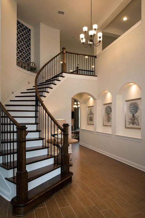 Descend to #dinner in style with a winding #staircase that leads to the spacious #foyer. #luxury #home #design Interior Design Living Room With Stairs, Winding Staircase Ideas, Wallpaper Luxury, Foyer Staircase, Luxury Staircase, Winding Staircase, House Staircase, Home Stairs Design, Modern Staircase