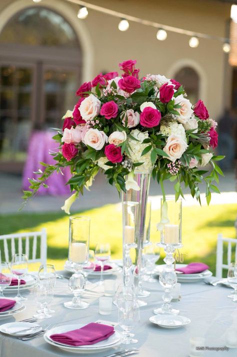 Obsessed with this tall centerpiece! The mix of blush and fuchsia flowers is stunning with the simple table top of all white and a fuchsia pop. The white chaivari chairs go perfectly with this gorgeous table. Pink And White Wedding Flowers Table, Magenta Wedding Decorations, Fuschia Wedding, Pink Decorations, Centerpieces For Wedding, Magenta Wedding, Tall Centerpiece, Striped Sweaters, Fuchsia Wedding