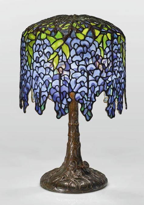 Tiffany Studios "PONY WISTERIA" TABLE LAMP shade impressed TIFFANY STUDIOS/NEW YORK/349-6 base impressed TIFFANY STUDIOS/NEW YORK/350 leaded glass, patinated bronze 17 in. (43.2 cm) high 10 1/2  in. (26.7 cm) diameter of shade circa 1905  Sold for USD 337.500  PROVENANCE Lillian Nassau, New York Private Collection, Boston, Massachusetts, circa 1960s Studio Lamp, Table Lamp Shade, Tiffany Studios, Art Glass Lamp, Stone Vase, Art Jewelry Design, Still Lifes, Table Lamp Shades, Tiffany Lamps