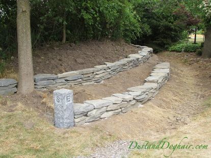 diy stacked stone garden wall, concrete masonry, landscape, outdoor living Retention Wall, Sister Tats, Cottage Patio, Stone Walls Garden, Hill Landscape, Stacked Stone Walls, Rustic Landscaping, Sloped Yard, Homestead House