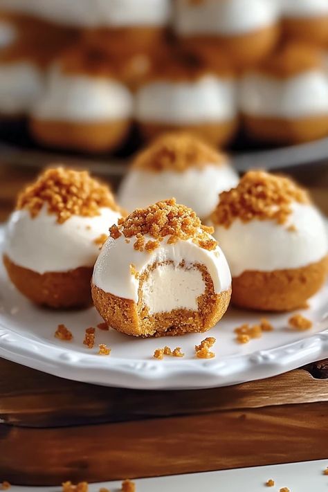 Indulge in the perfect fall treat with these No-Bake Pumpkin Cheesecake Balls! Creamy, spiced pumpkin meets tangy cheesecake in bite-sized delights that are easy to make and even easier to devour. The ultimate no-bake dessert for pumpkin lovers!

#PumpkinCheesecakeBalls #NoBakeDesserts #FallTreats #PumpkinSpice #EasyDessertRecipes #PumpkinLovers #CheesecakeBites No Bake Pumpkin Cheesecake Balls, No Bake Pumpkin Pie Cheesecake, Pumpkin Cheesecake Balls, Pumpkin Balls, Cheesecake Balls, Cream Cheese Ball, Fast Desserts, Bake Pumpkin, No Bake Pumpkin Cheesecake