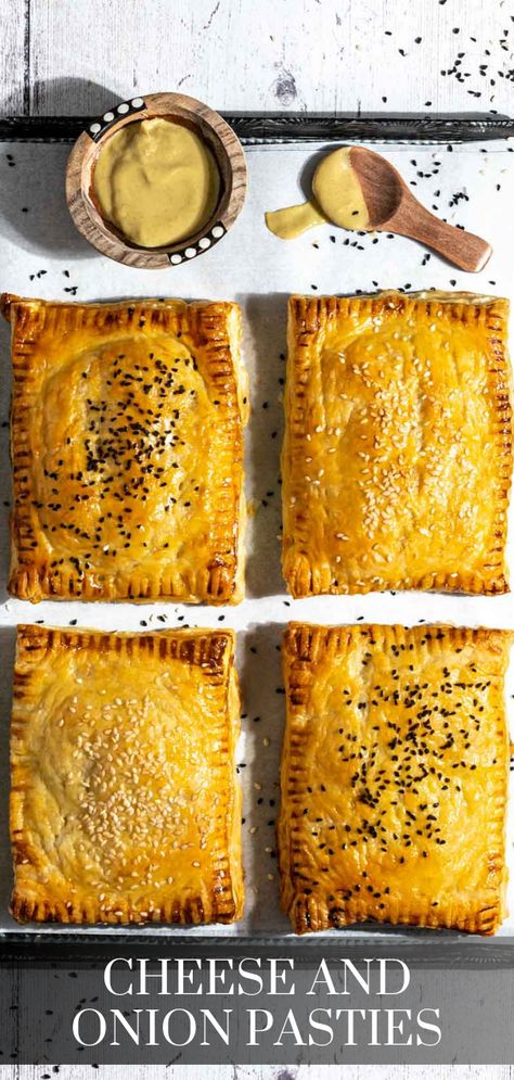 Four cheese and onion pasties on a baking sheet with a small bowl of mustard. Cheese And Onion Pasty, Puff Pastry Shells, Chicken Puffs, Pasties Recipes, Caramelised Onion, Potato Cheese, British Dishes, Nigella Seeds, British Baking