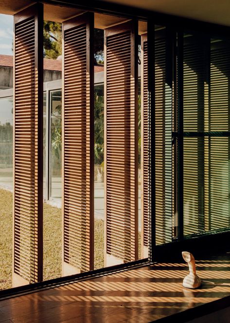 Modern Filipino Interior, Sliding Shutters, Louver Windows, Stone Wall Design, Tropical Architecture, Wooden Screen, Shutters Exterior, Tropical House, Wooden Slats