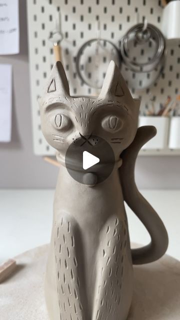 Dóttir Studio by Jess King on Instagram: "I love cats and cats love me back. *sound on* 😆   This is a new candle holder design I’ve been working on. I’d planned it half the size but it took on a life of it’s own ✨   It feels good to have my hands in clay again now I have my days back✨ . . . . . . . #dottirstudio #greenware #catsofinstagram #handmadeceramics #handmade #catstagram #ceramicanimals #ceramics #ceramicsofinstagram #ceramilicious #potterylove #workinprogress #makersgonnamake #catlover #potteryforall #ceramicart #contemporaryceramics #cerámica #homedecor #whimsicalart #animalart" Ceramic Cats Pottery, Cat Ceramic Ideas, Greenware Ceramics, Candle Holder Clay, Cat Ceramics, Cat Clay, Love Me Back, Cat Candle Holder, Clay Cat