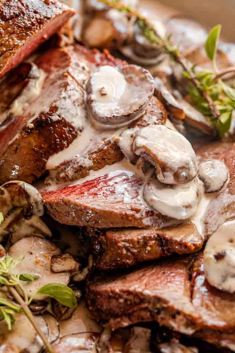 Tried and true method for the most amazing, tender and juicy roasted Beef Tenderloin. This Beef Tenderloin with Mushroom Gravy has a luxurious, made-from-scratch sauce added to the succulent roast. This is the most PERFECT dinner for the holidays! #holidaydinner #christmasdinner Beef Tenderloin With Mushroom Sauce, Gravy For Beef Tenderloin, Easy Salisbury Steak, Leftover Gravy, Creamy Mashed Cauliflower, Beef Tenderloin Recipes, Mushroom Gravy Recipe, Salisbury Steak Recipes, Savory Food