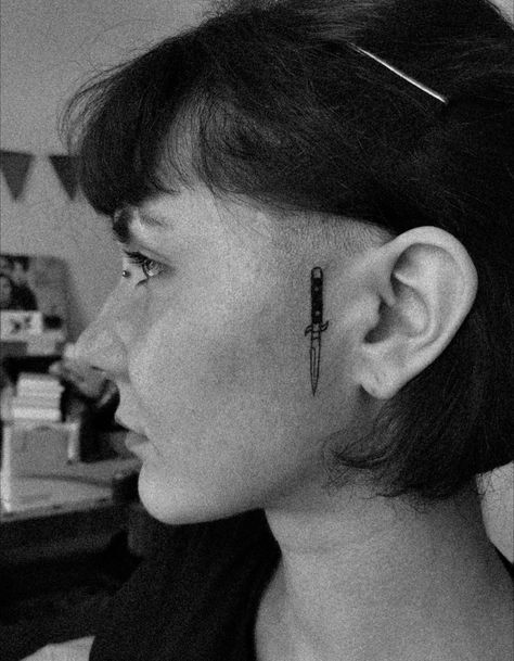 Knife Tattoo Behind Ear, Grunge Face Tattoos, Face Tattoo Near Ear, Knife Behind Ear Tattoo, Next To Ear Face Tattoo, Face Tattoo By Ear, Dagger Tattoo Behind Ear, Unique Face Tattoos, Face Tattoo Women