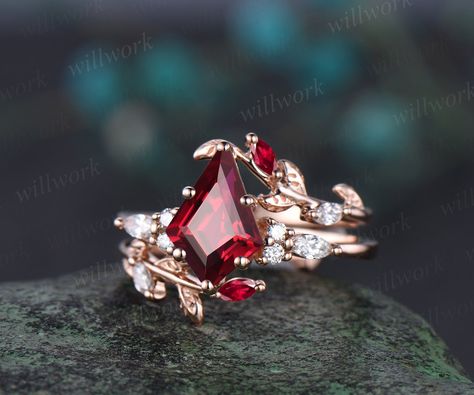 - Metal: Solid gold(10K/14K/18K white/yellow/rose gold),925 sterling silver,platinum available- Main Stone: 7x10mm kite-cut lab ruby- Accent Stone: 1.5mm round and 2x4mm marquise diamonds or moissanites- Wedding Band Stone: lab ruby and diamonds or moissanites- Band Width: 1.3-1.4mm- Can be personalized: Yes Ruby Ring Rose Gold, Gold Ruby Wedding Rings, Red Stone Engagement Rings, Ruby Engagement Ring Gold, Red Engagement Ring, Diamond Enhancer, Ruby Wedding Rings, Wedding Anniversary Ring, Topaz Birthstone