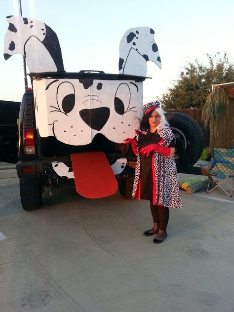 Trunk or Treat ideas Cruella Deville & dalmatian. The dalmatian is a refrigerator box from the local furniture store, spray paint & a big sharpie marker. I stuck it to my car with gorilla tape (I've done it MANY times, never hurts the paint) my outfit is just fabric that I bought & hot glued together. Trunk Or Treat Ideas For Cars 101 Dalmations, Dog Trunk Or Treat Ideas For Cars, Dalmation Trunk Or Treat, 101 Dalmation Trunk Or Treat, Dog Themed Trunk Or Treat Ideas, 101 Dalmatians Set Design, Cruella Deville Trunk Or Treat, Trunk Or Treat Dalmations, 101 Dalmations Trunk Or Treat Ideas