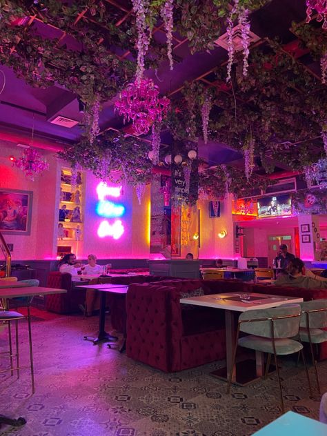 Neon Restaurant Aesthetic, Pink Mexican Restaurant, Trippy Restaurant, Bar With Neon Lights, Neon Light Restaurant, Cute Restaurant Aesthetic, Alice In Wonderland Bar, Alice In Wonderland Coffee Shop, Pink Bar Aesthetic