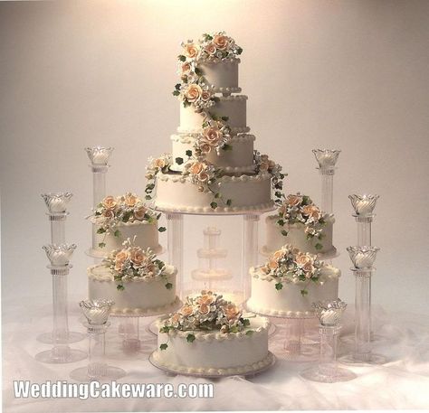 7 Tier Cake Wedding, 3 Wedding Cakes Display, Cakes With Fountains, Cascading Wedding Cake, Cascade Wedding Cake, Fountain Wedding, Fountain Wedding Cakes, Unique Cake Stands, Rustic Wedding Cake Stand