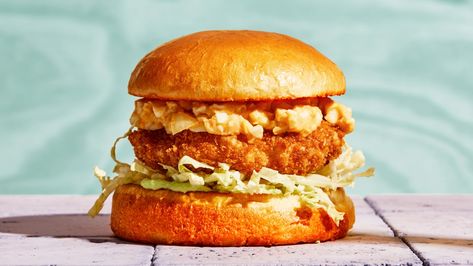 Topped with crunchy cabbage and creamy egg salad, and nestled between toasted brioche buns, these extra-crispy shrimp burgers over-the-top in the best way. Shrimp Patties, Shrimp Burger, Creamy Eggs, Crispy Shrimp, Savoy Cabbage, Fried Shrimp, Brioche Buns, Lobster Roll, Egg Salad