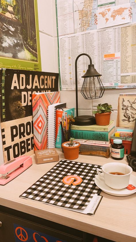 Checkered folder, corner of office with rich colors, eclectic Knick nacks and a lamp. Grandmillenial Maximalist, Pink Stapler, Cubicle Decor Office Work Spaces, Boho Cubicle Decor, Eclectic Office Decor, Maximalist Office, Cozy Cubicle, Office Decor Workplace, Maximalist Vintage