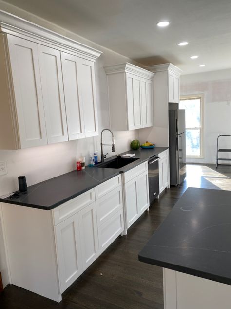 Full overlay kitchen with shaker style doors. Black countertop. #blackandwhite #whitekitchencabinets #whitekitchens #shakerstyle White Kitchen Dark Countertops, Black Soapstone Countertops, White Kichen, Clean White Kitchen, Black Soapstone, Soapstone Kitchen, Black Countertop, Dark Counters, Soapstone Countertops